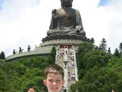 Hong Kong 01 07 Peter with Tian Tan Buddha Behind Lantau is the largest outlying island in Hong Kong, almost twice the size of Hong Kong Island. The Po Lin (Precious Lotus) Monastery is located on western...
